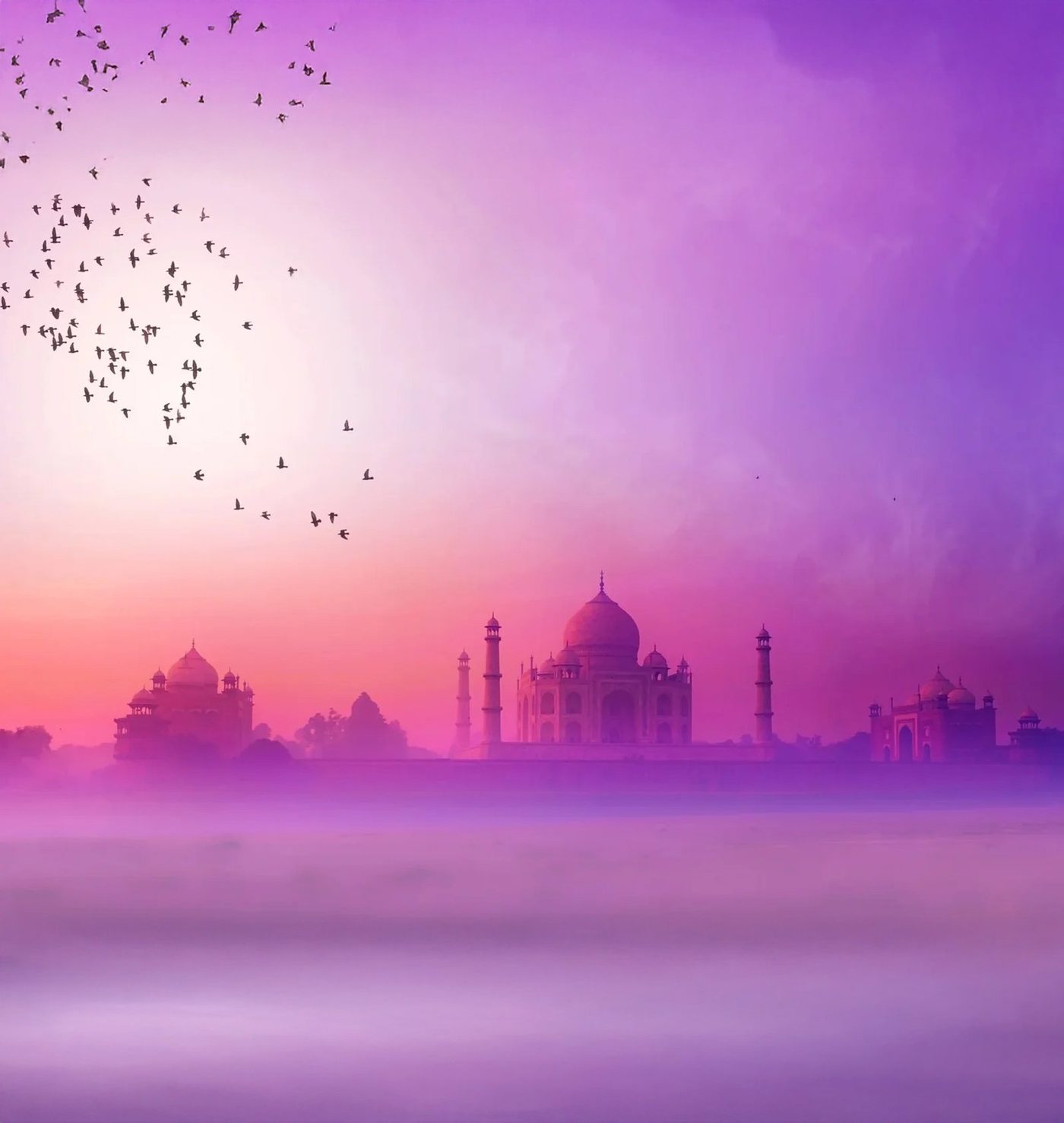 The Taj Mahal at Agra glowing at sunrise