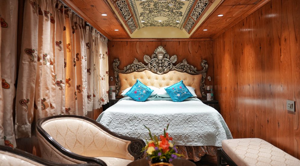 An elegant white-and-gold cabin aboard the Palace on Wheels
